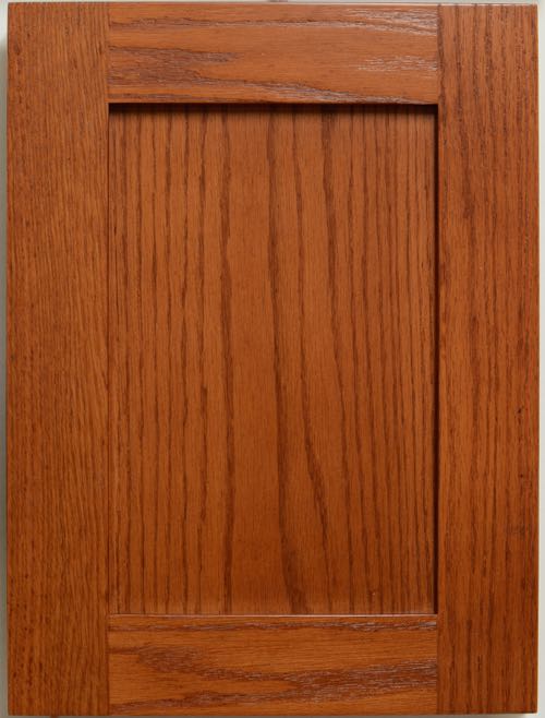 Lancaster shaker style flat panel door in Red Oak with a custom Glamour Cherry finish.